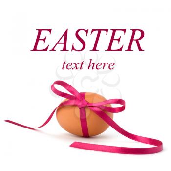 Easter egg with festive bow isolated on white background