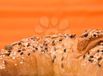fresh croissant  on orange background