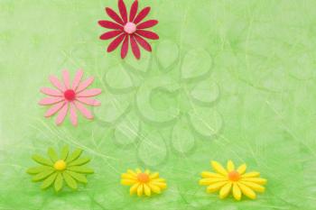 Spring background. Flowers on green sisal background, selective DOF.