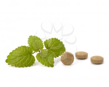 Herbal pills isolated on white background. Alternative medicine concept.