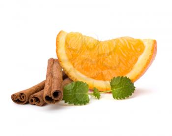 Orange fruit segment, cinnamon sticks and mint isolated on white background. Hot drinks ingredients.