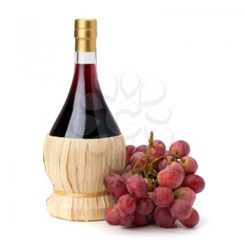 Full red wine bottle and grapes isolated on white background