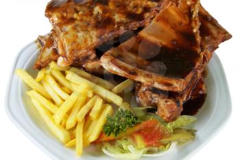 Isolated Spareribs and Fries on White Plate Close Up