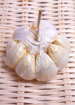 healthy white vegetable pungent garlic on background