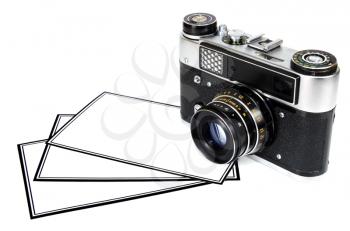 old retro photo camera and blank photo isolated on white background