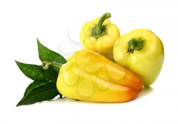yellow pepper and green leaf isolated on white background