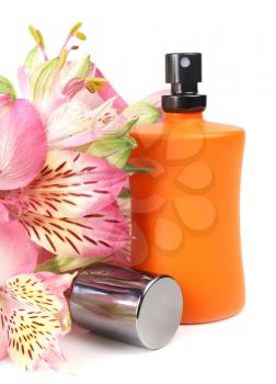 small bottle with a perfume liquid and flowers isolated on white background