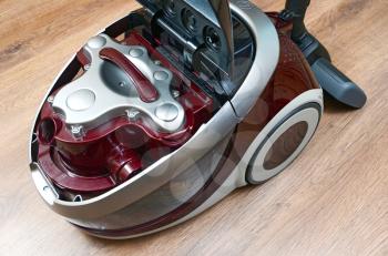 red vacuum cleaner with water filter