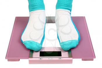 woman feet on floor scales isolated on white background