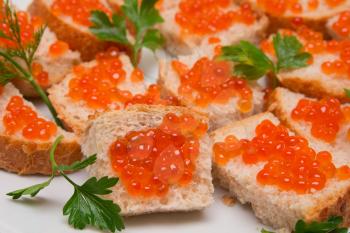 red caviar on bread with parsley