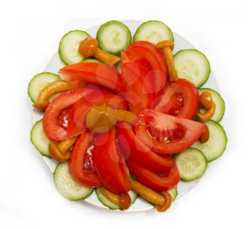 a salad of tomatoes, mushrooms and cucumbers