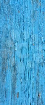 Closing on blue wooden panels of the fence 