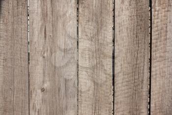 Close up of gray wooden fence panels 