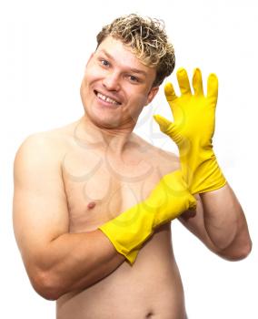 man in yellow rubber gloves on white background