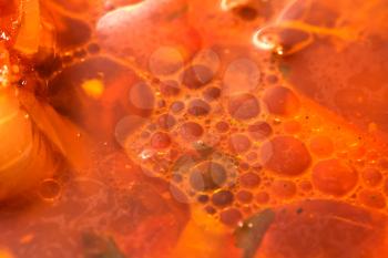 background of the oil in a soup. macro