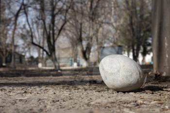 a large round stone on the ground