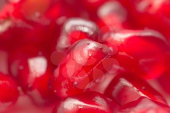 fresh red juicy pomegranate . macro