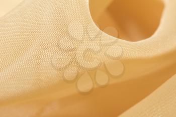 golden fabric as a background. macro