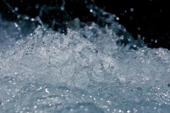 rough water with splashes on a black background