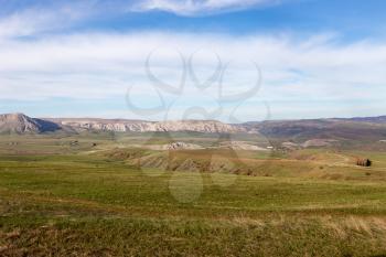 Steppes and mountains in Kazakhstan as a background .