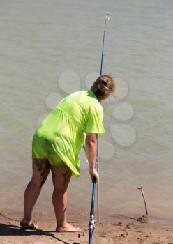 The girl is fishing for the bait .