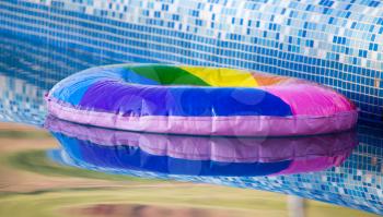 Inflatable balloon on the water in the pool .