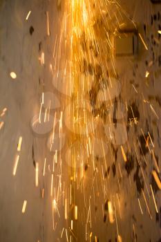 Sparks from cutting metal as a background .