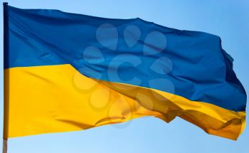 flag of Ukraine against the blue sky .