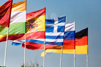 flags of different countries against the blue sky .