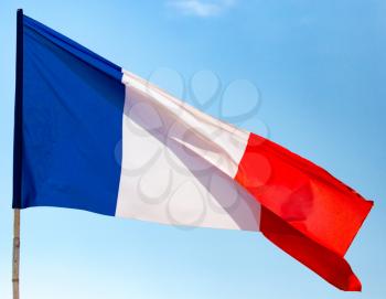 flag of France against the blue sky .