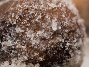 snowflake on a frozen mushroom. macro