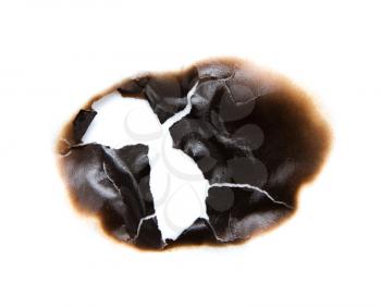 burned hole on a white paper background