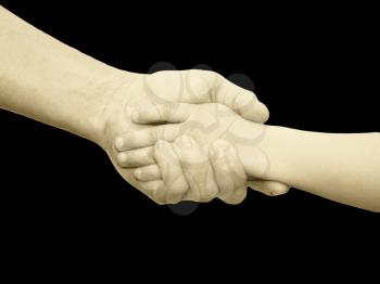 hands of father and son on a black background