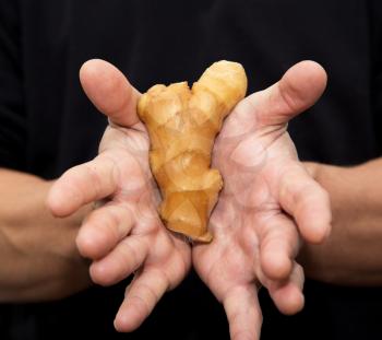 ginger root in hand