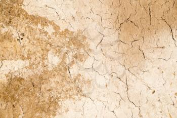 abstract background of cracked clay wall