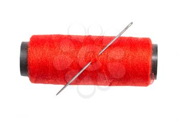 red thread with a needle on a white background. macro