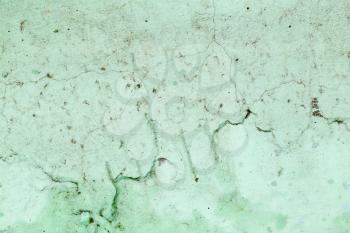 abstract background of old cracked green wall