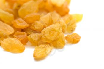 yellow raisins on a white background. macro