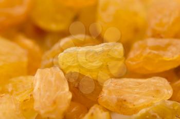 background of yellow raisins. macro