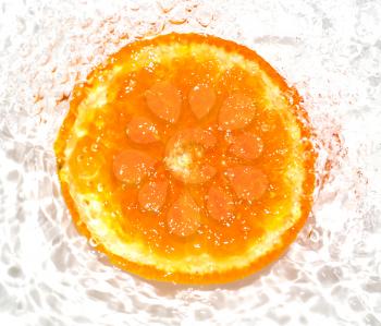 orange in water on a white background. macro