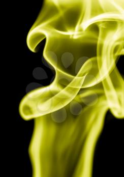 yellow smoke on a black background