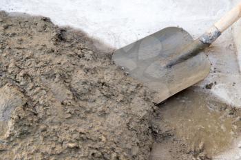 cement solution with a shovel