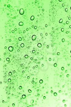 water drops on green glass