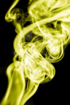 yellow smoke on a black background