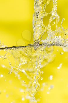 splashes of water on a yellow background