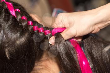 weave braids in a beauty salon