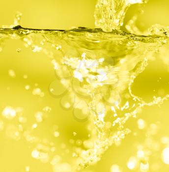 splashes of water on a yellow background