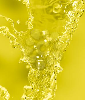 splashes of water on a yellow background