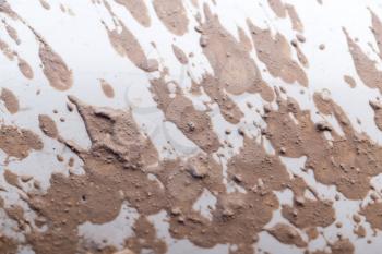 close-up texture isolated mud splashes by car in natural lighting