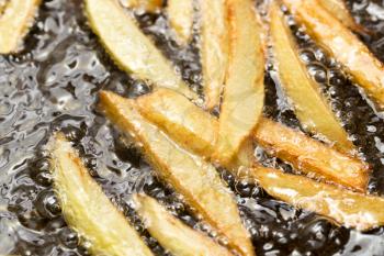 French fries fried in a pan